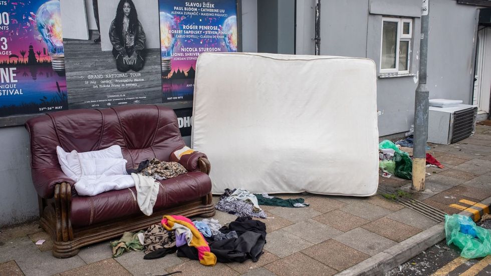 A sofa and mattress dumped on the street