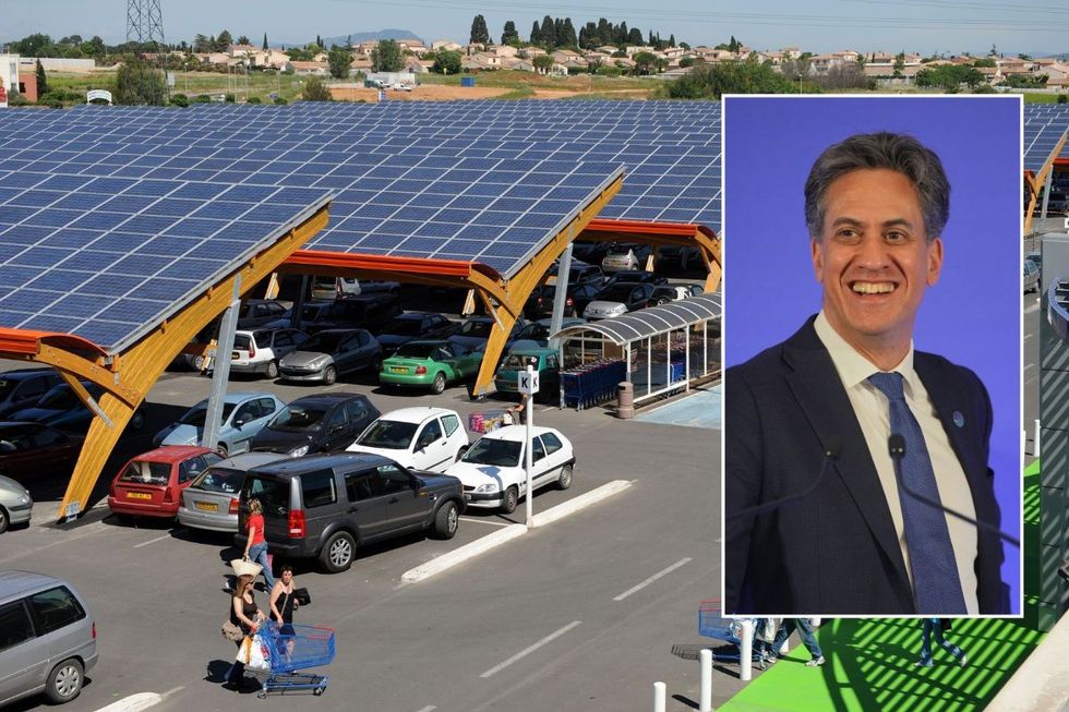 A solar canopy above a car park and Energy Secretary Ed Miliband