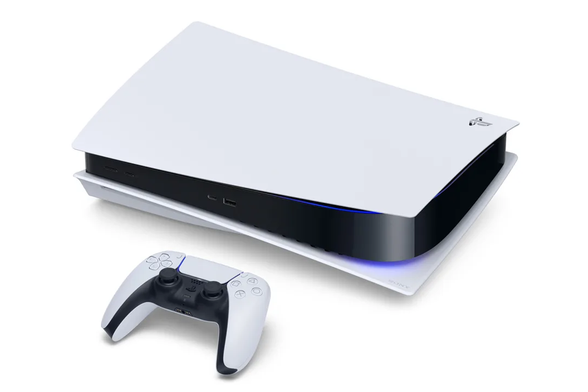 a sony ps5 lying on its side with the controller infront of it 