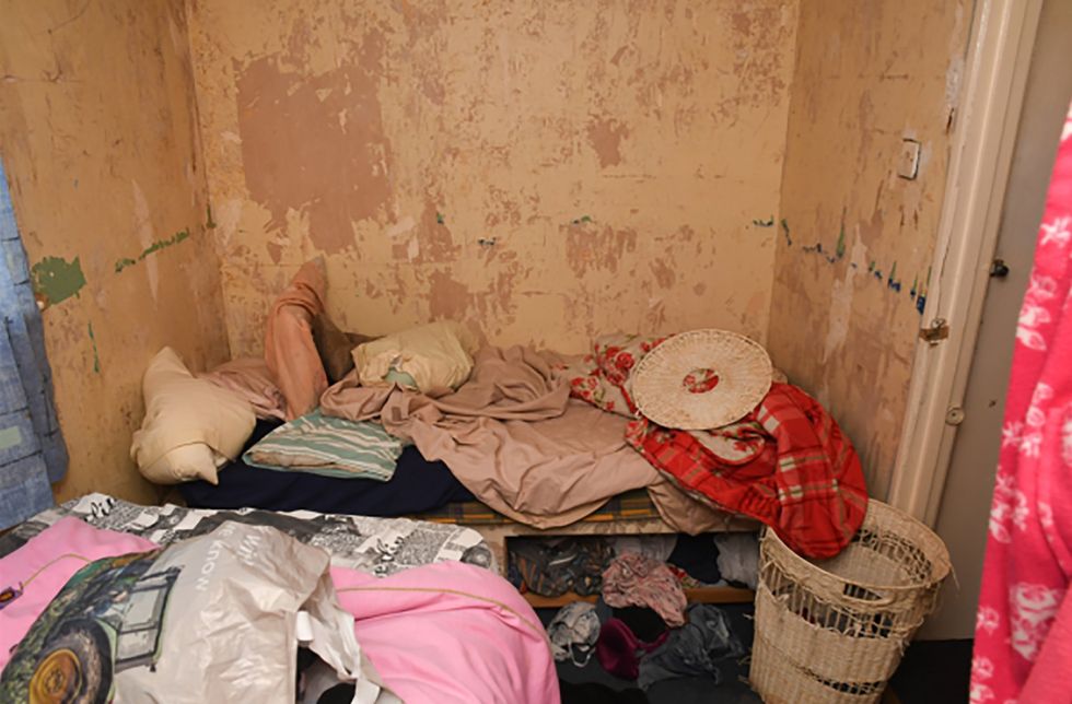 A squalid looking, messy room which was the victim's bedroom in Wixon's house