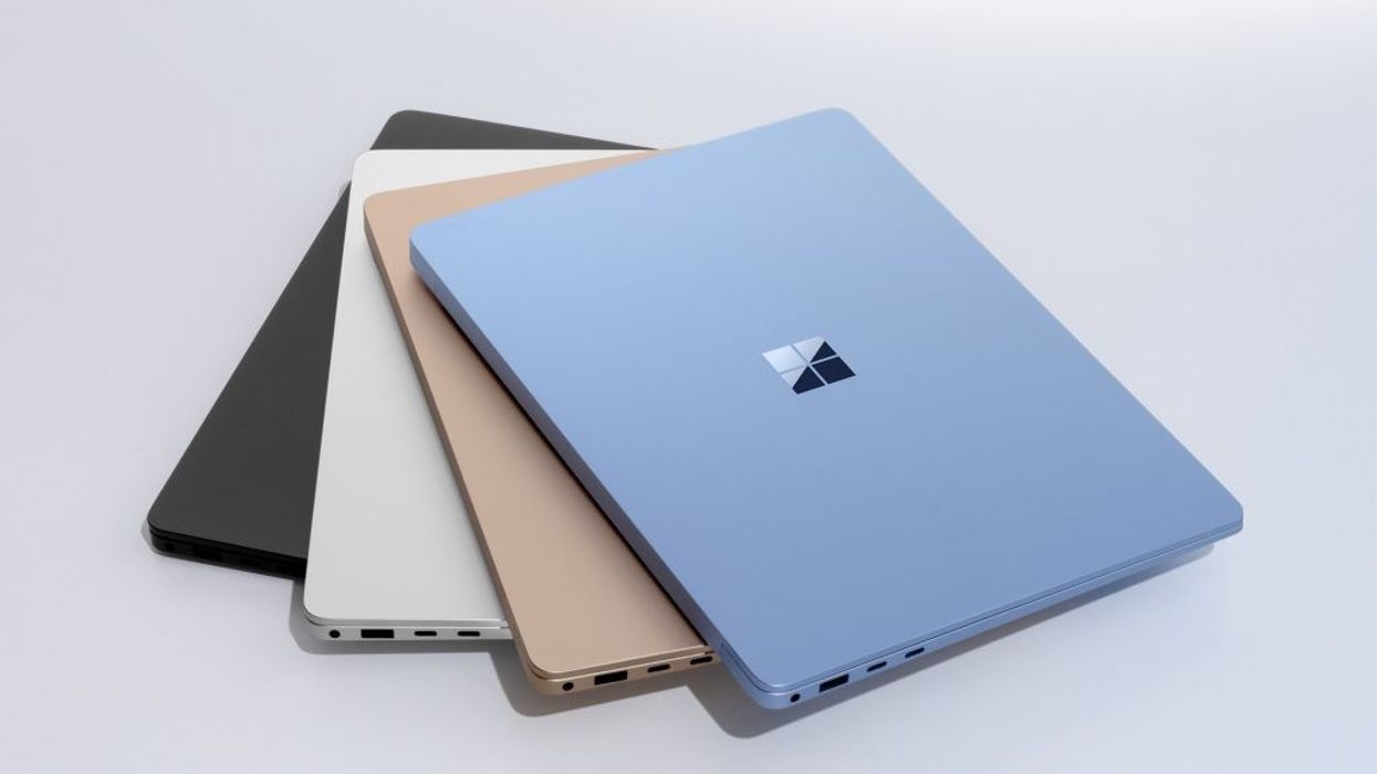 a stack of microsoft surface laptops