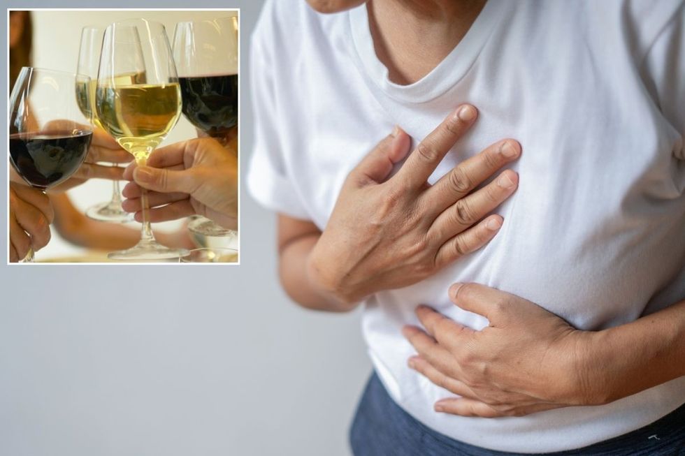 A stock image of a man suffering a heart attack and glasses of wine
