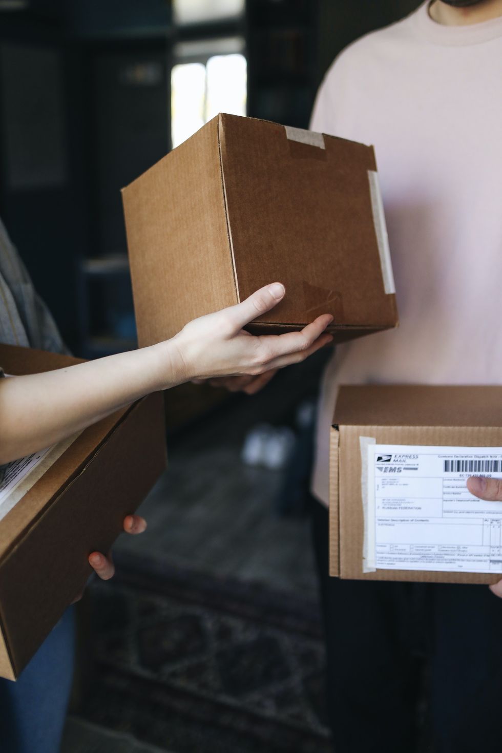 A stock image of a person receiving a delivery