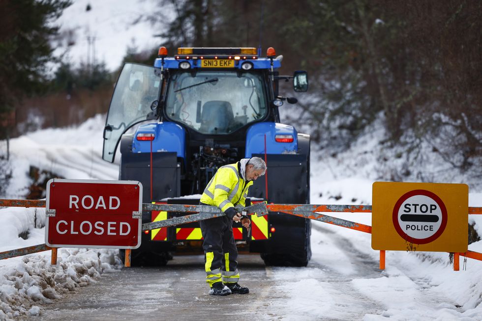 A stock image of a tractor being cut off by a closed road
