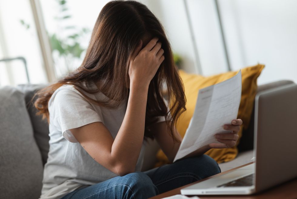 A stock image of a woman reading a letter