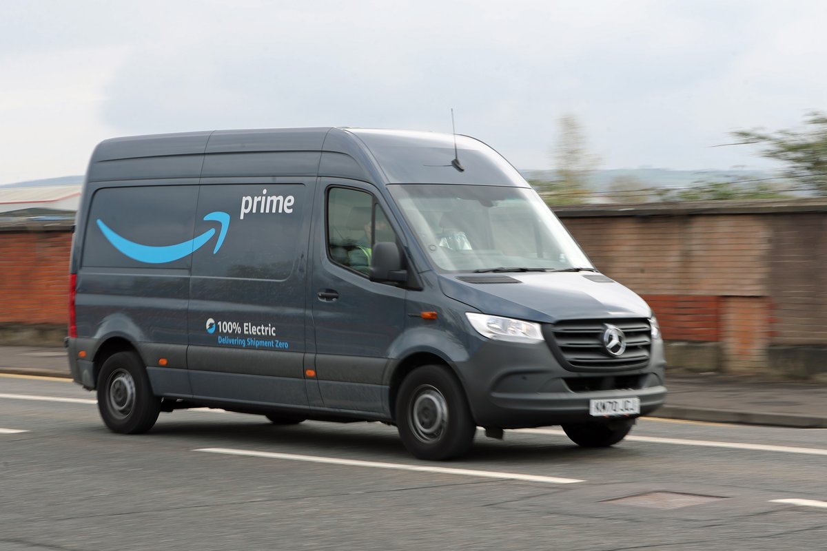 A stock image of an Amazon delivery driver