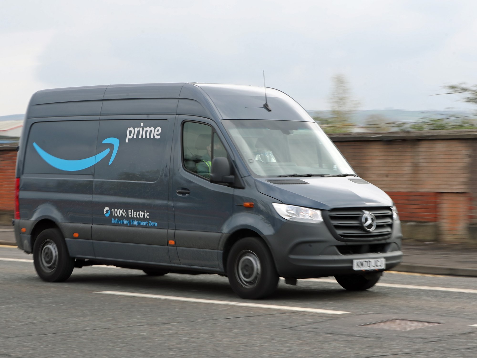 A stock image of an Amazon delivery driver