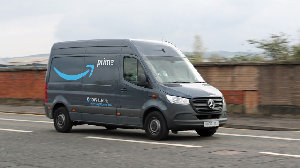 A stock image of an Amazon delivery driver