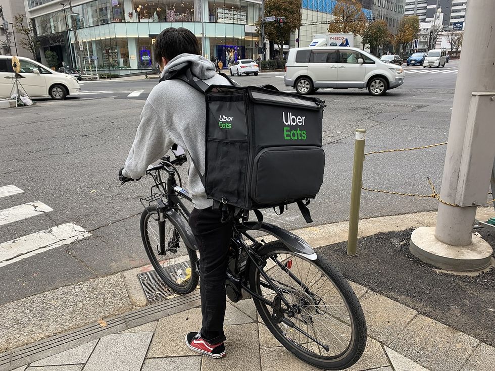 A stock image of an Uber Eats rider on a bicycle