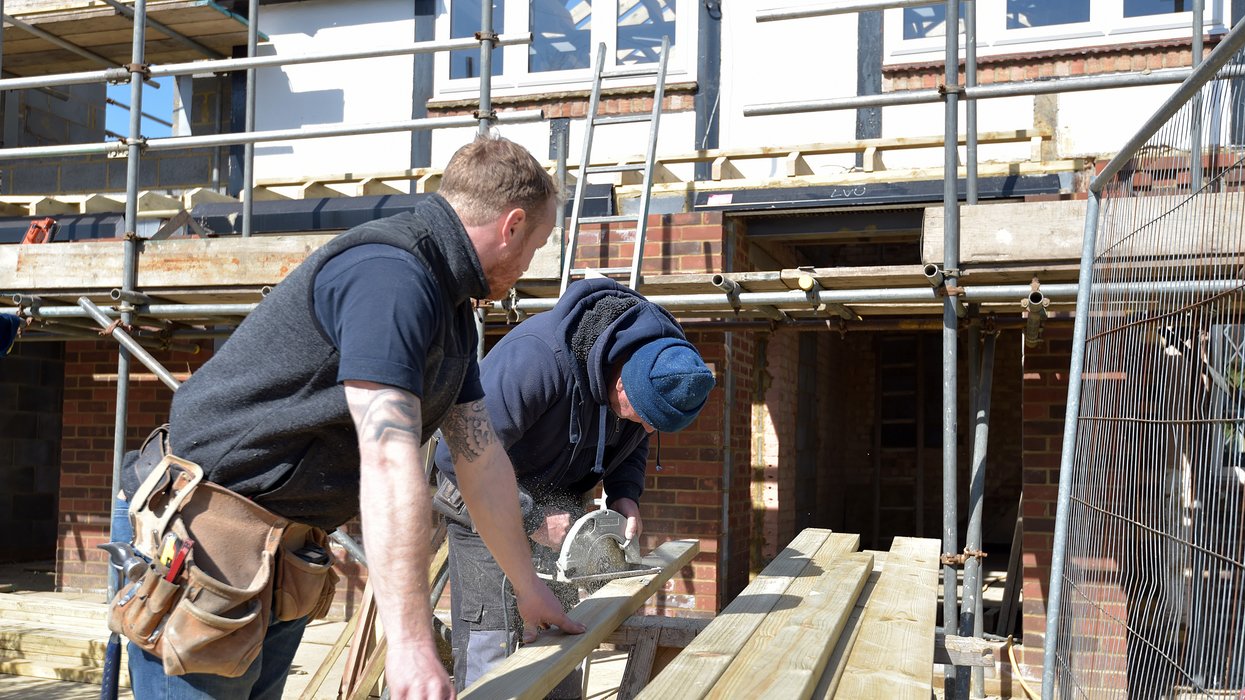 A stock image of builders working