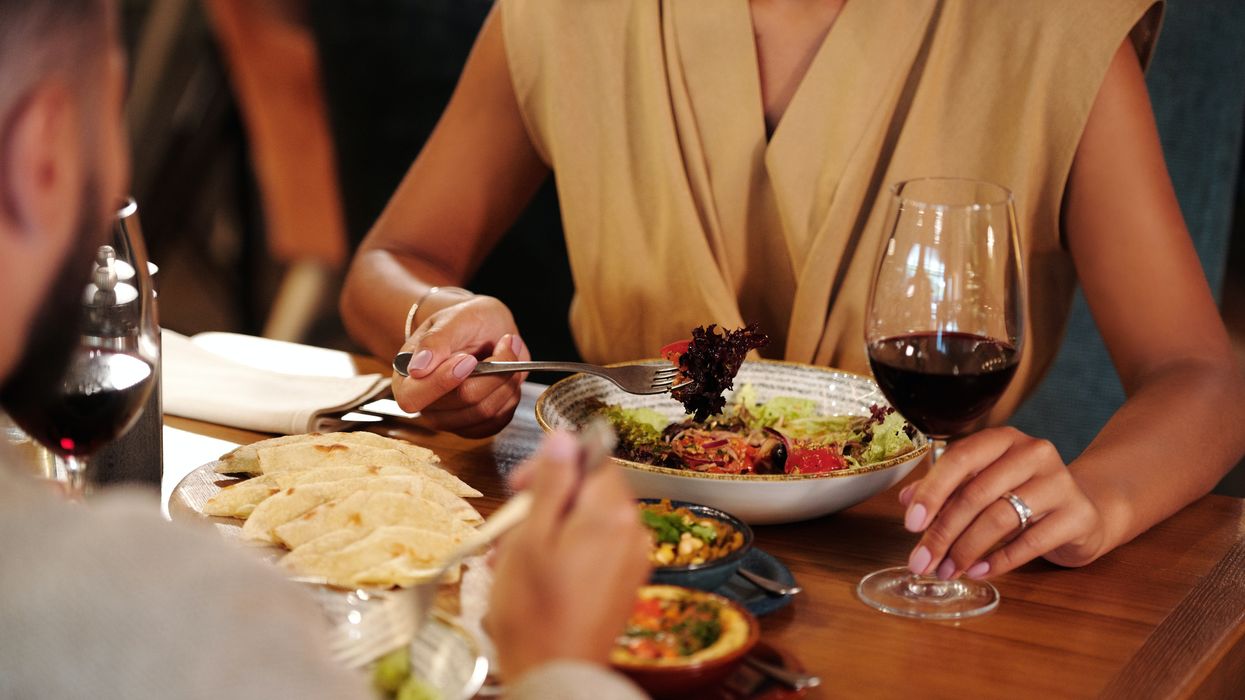 A stock image of people eating dinner