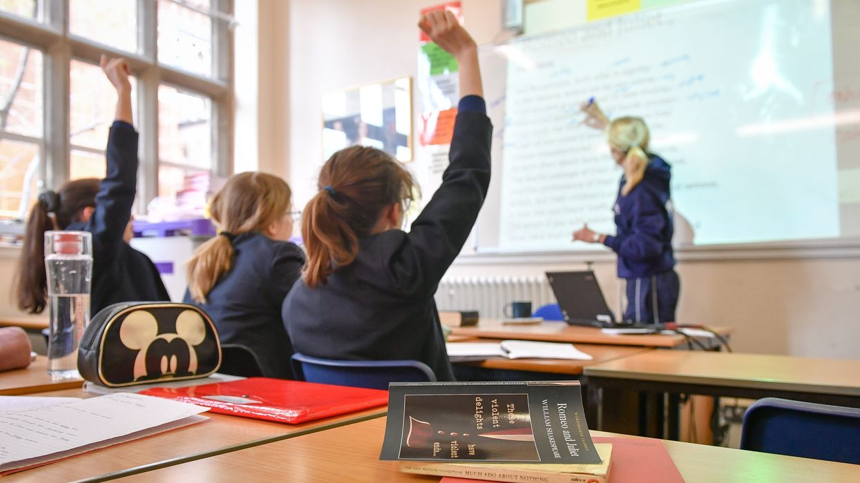 A stock image of school children in a classroom