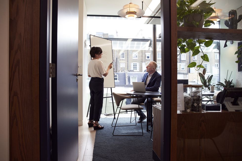 A stock image of two workers in an office