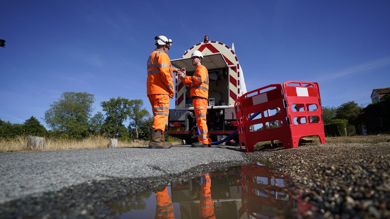A stock image of workers from Thames Water delivering a temporary water supply from a tanker to the village of Northend
