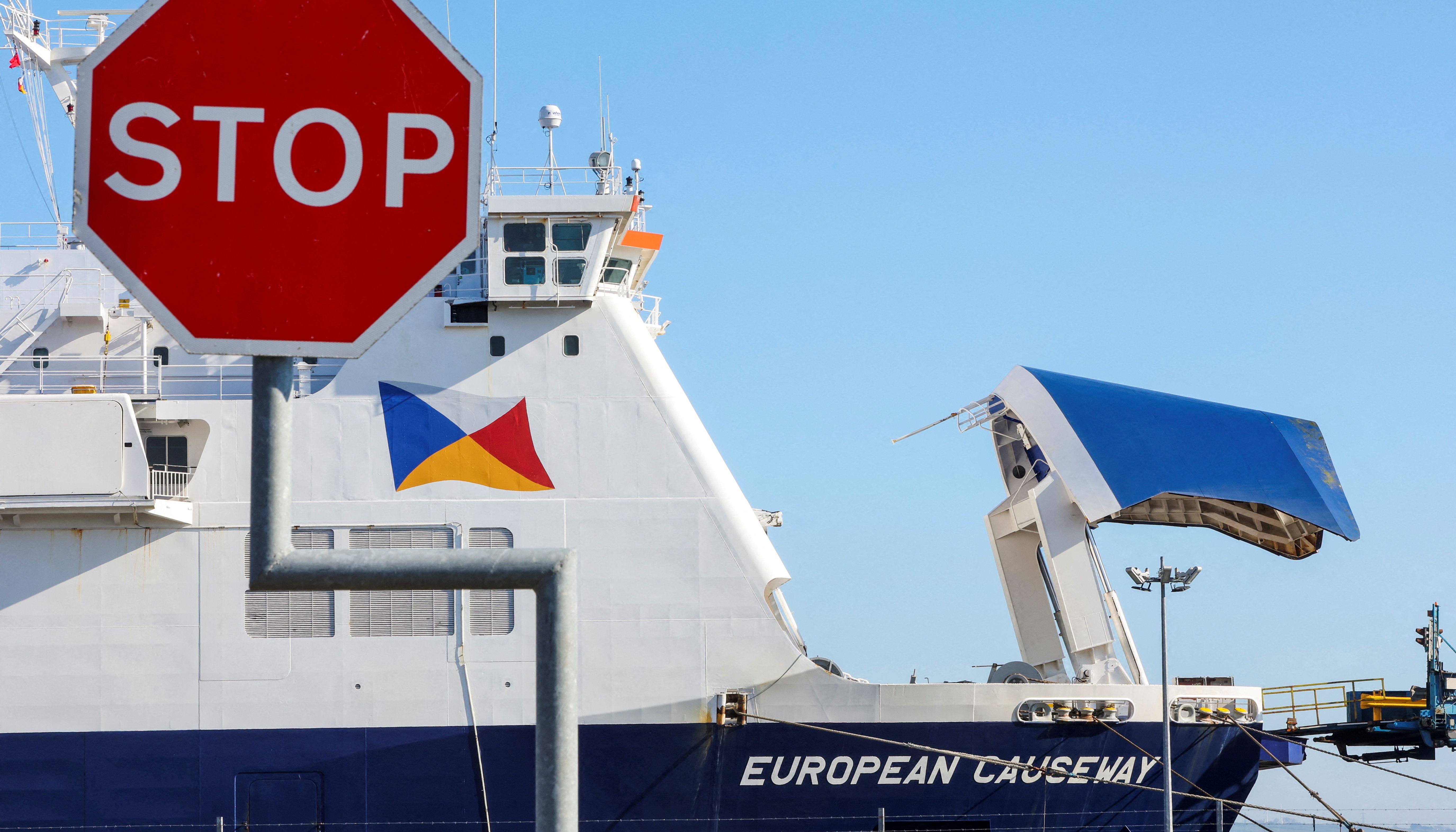 A stop sign is pictured in front of the P&O Ferries ship European Causeway, held in the Port of Larne, Northern Ireland March 27, 2022.