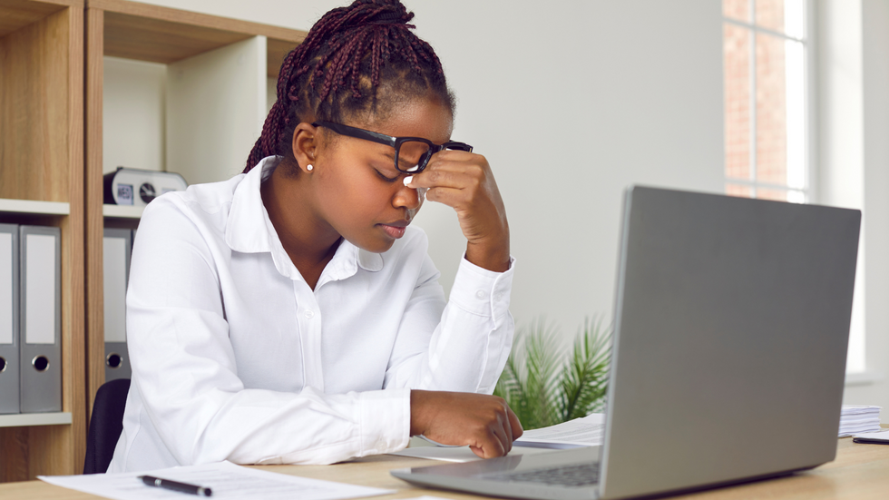 A stressed-looking office worker