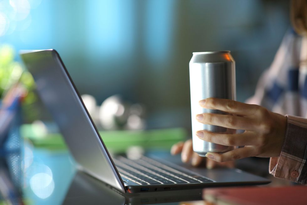 A student having an energy drink