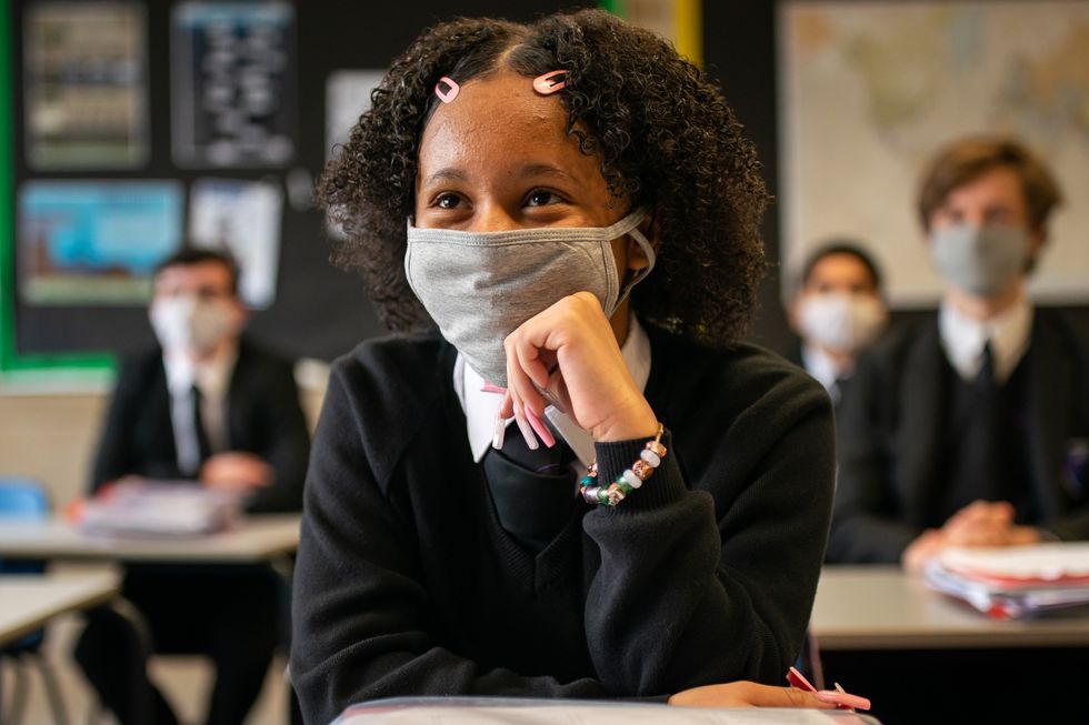 A student wearing a face mask in the classroom