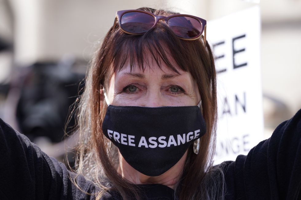 A supporter of Julian Assange outside the Royal Courts of Justice in London, ahead of the latest stage of his US extradition legal battle