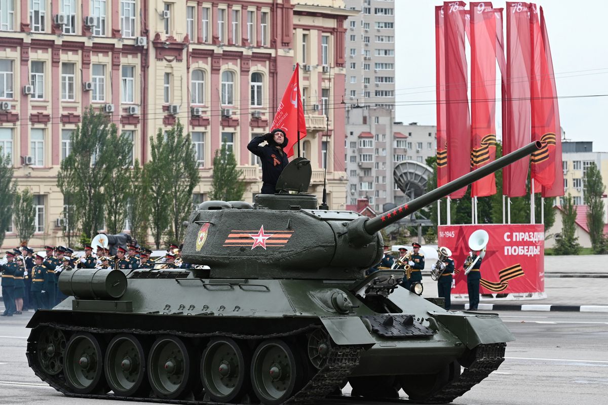 A T-34 Soviet-era tank drives during a military parade on Victory Day