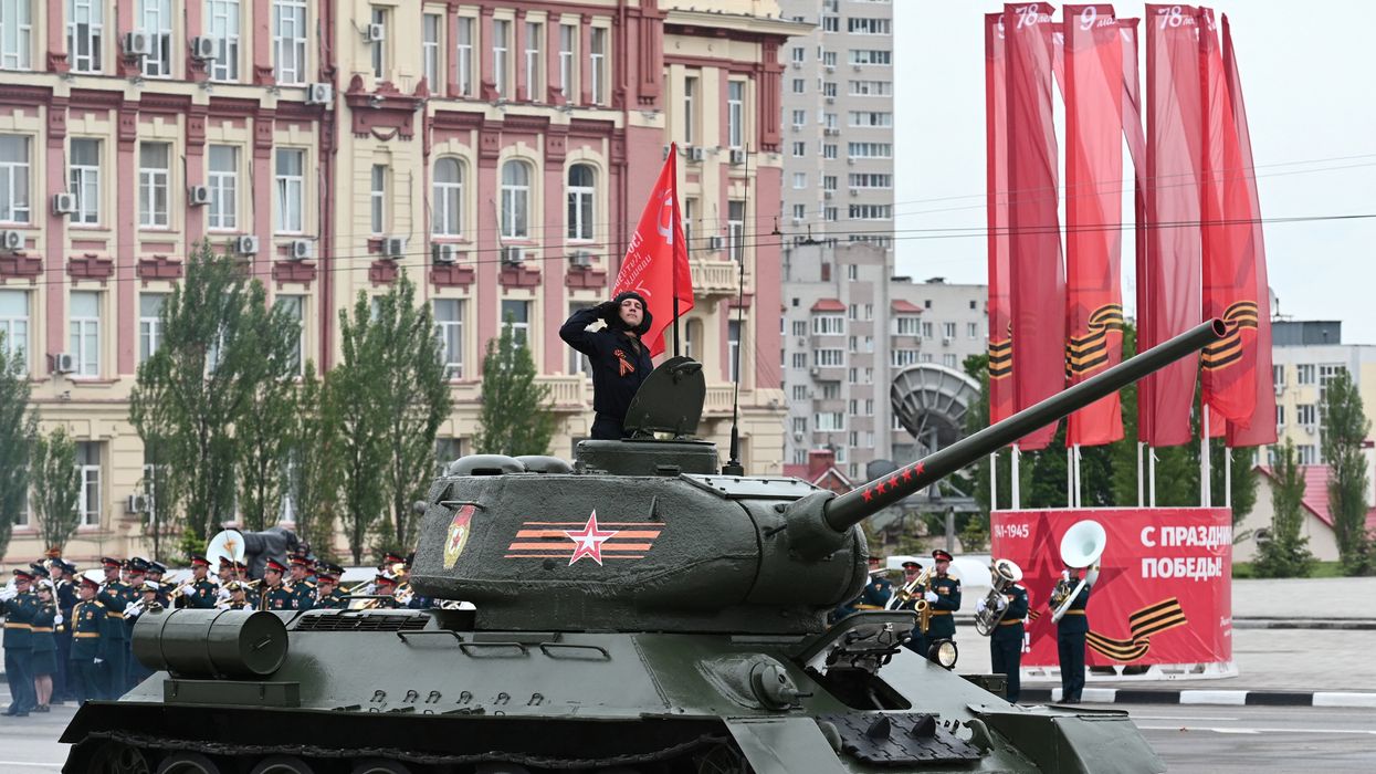 A T-34 Soviet-era tank drives during a military parade on Victory Day