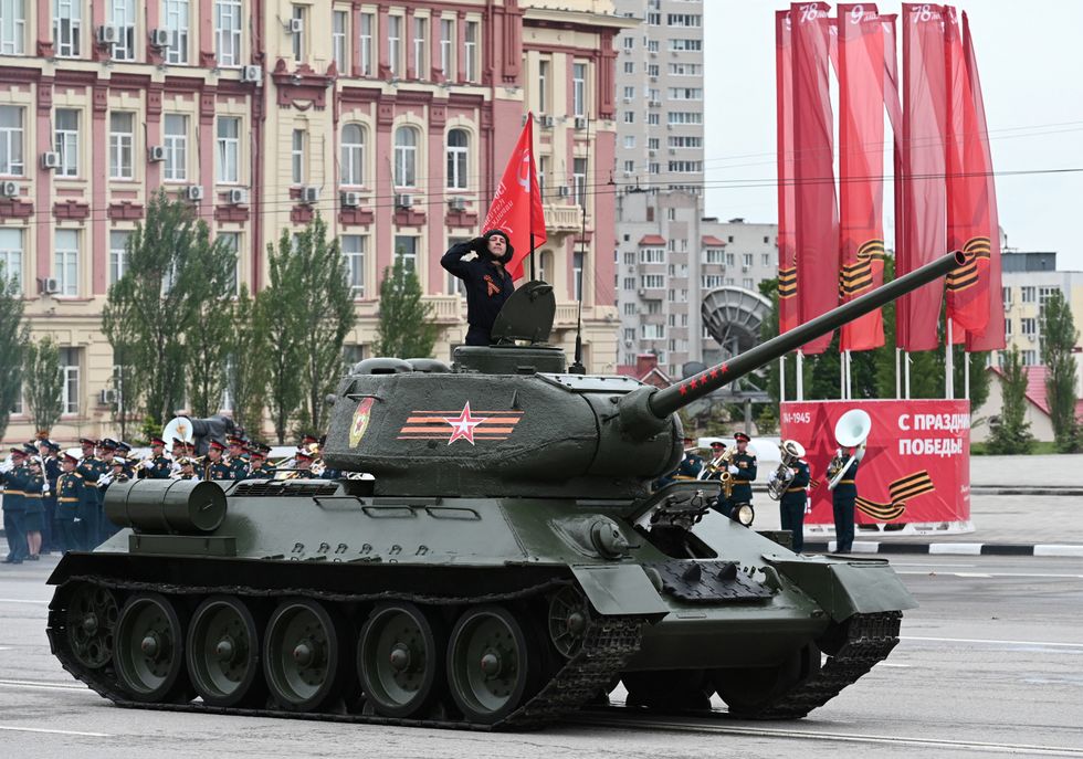 A T-34 Soviet-era tank drives during a military parade on Victory Day
