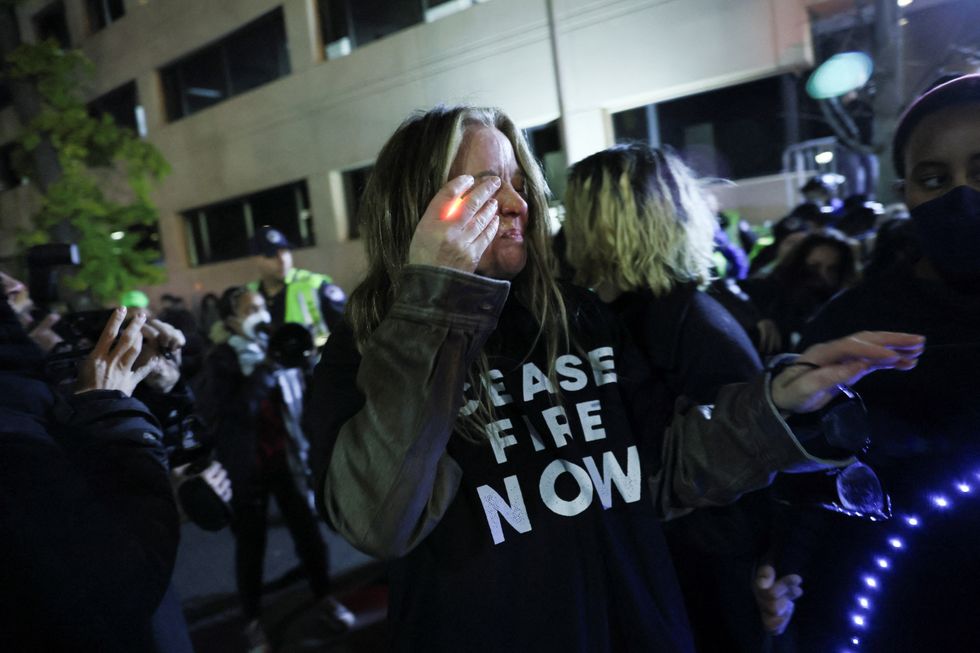 A t shirt saying "cease fire now"