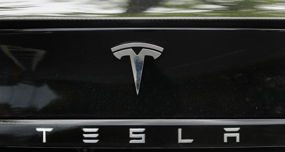 A Tesla logo on a Tesla Model S car at a launch event for the MobilityX self-driving conference, a gathering of global autonomous vehicle leaders, in Dublin.