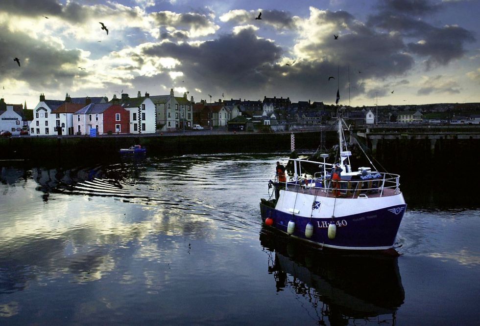 A trawler leaving a harbour