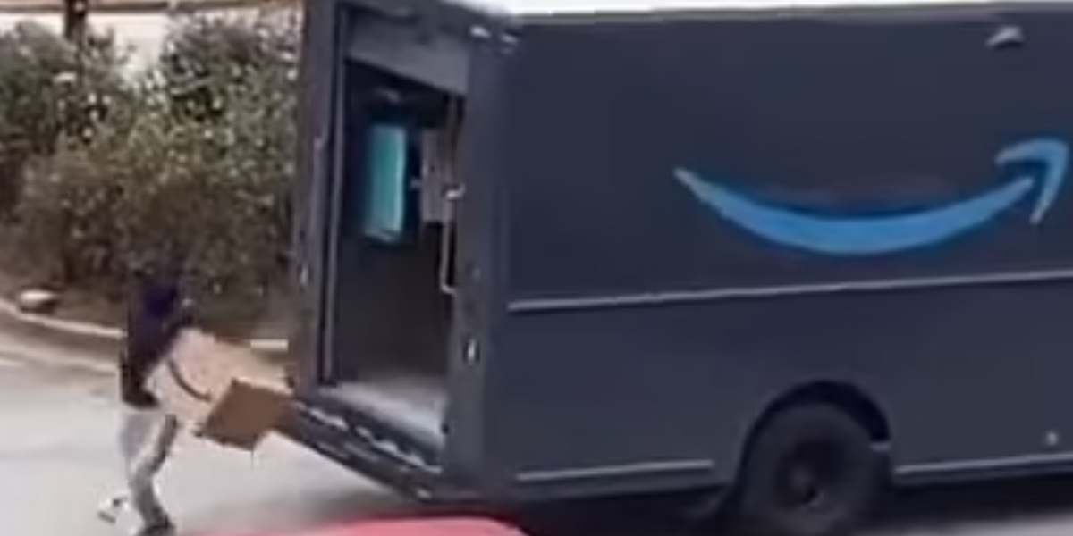 NextImg:Amazon delivery van raided by yobs in shocking daylight theft as helpless driver watches on