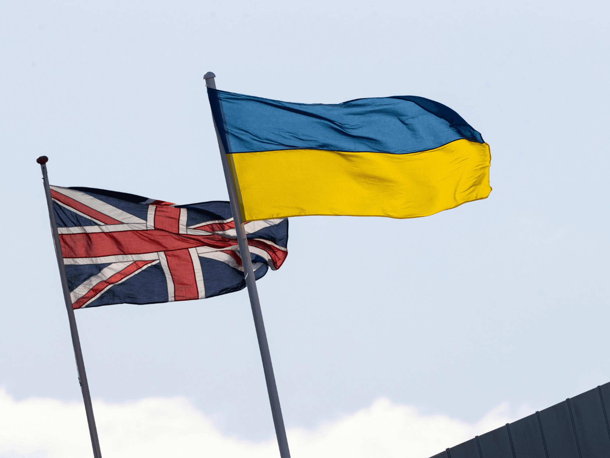 A Ukraine flag and Union Jack flag