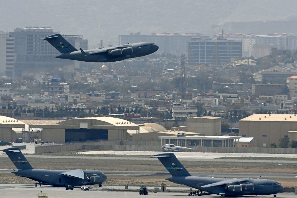 A US Air Force aircraft takes off from the airport in Kabul amid the 2021 Afghanistan evacuation