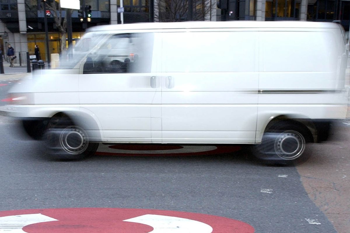 A van passes through the start of the Congestion Charge Zone