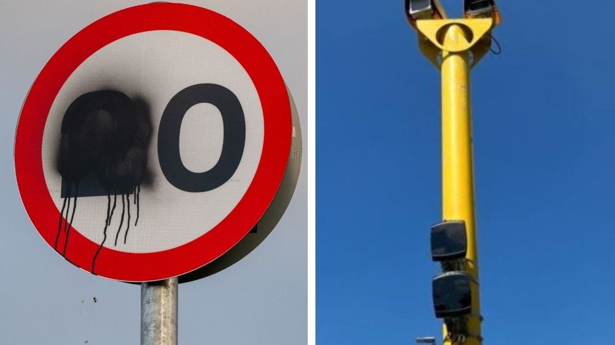 A vandalised 20mph speed limit sign and a speed camera