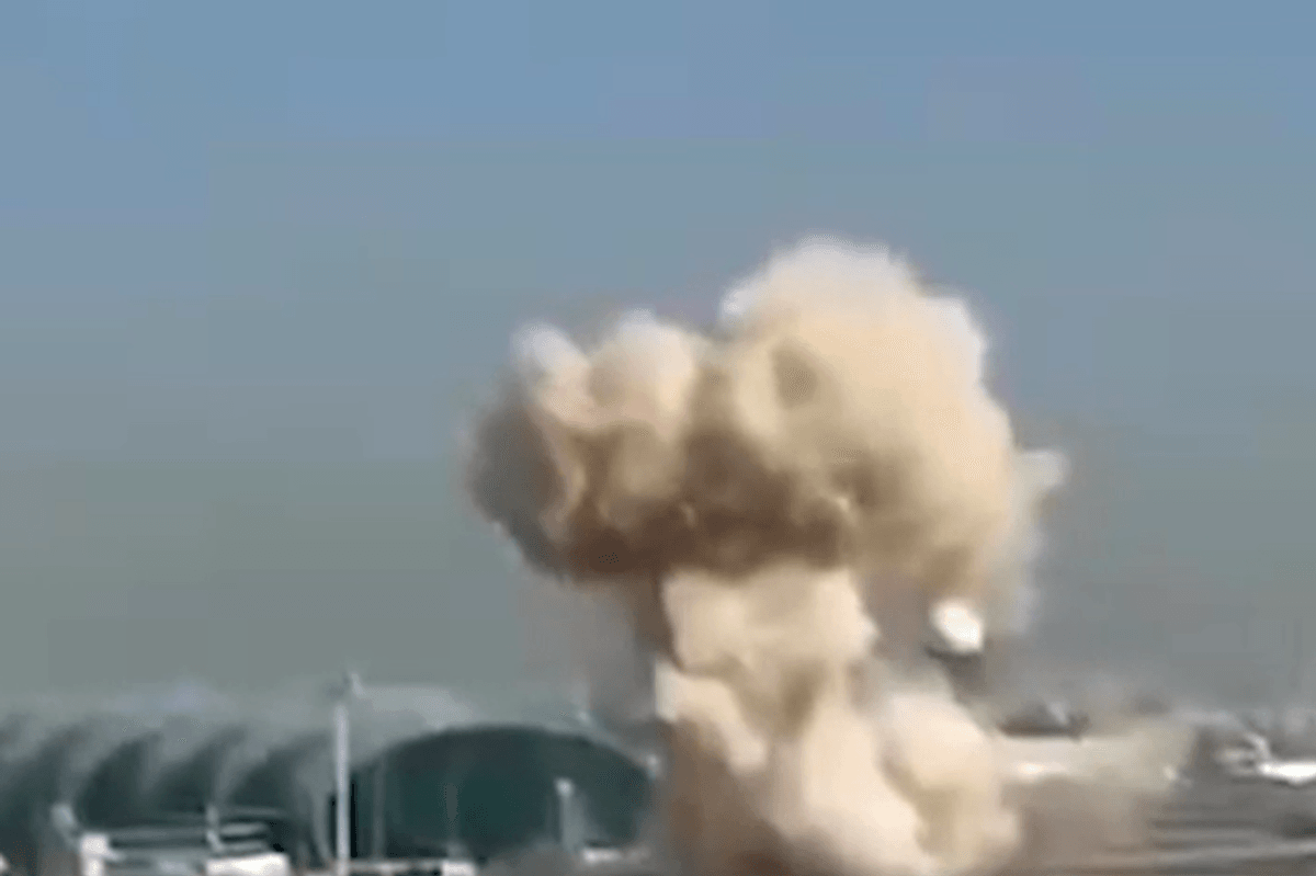 A video shows the shocking moment a building was hit after a drone could be seen soaring through the sky