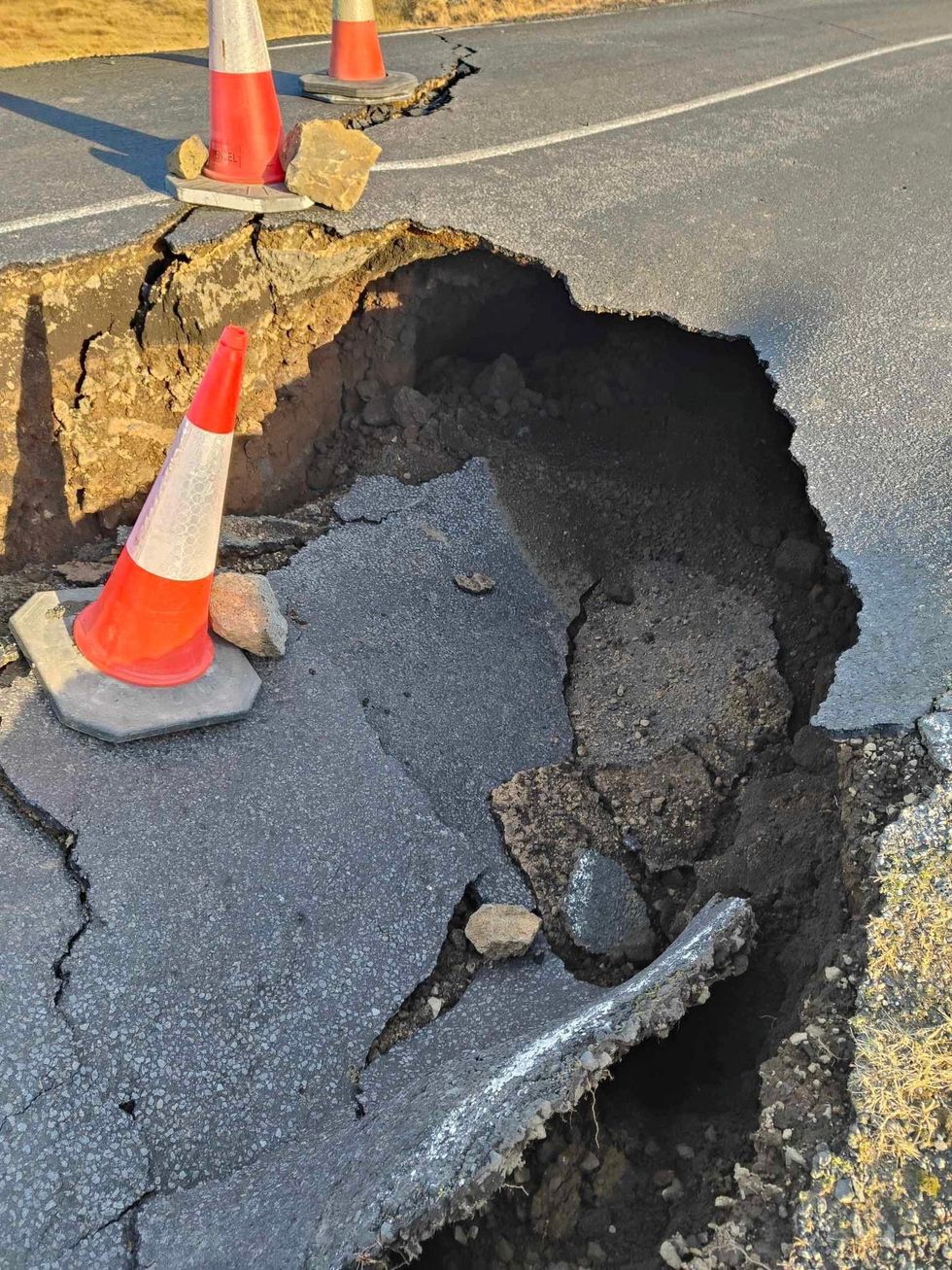 A view of cracks, emerged on a road due to volcanic activity, near Grindavik