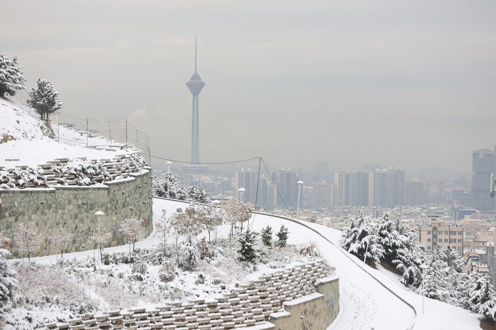 A view of Milad Tower during the first snowfall in Tehran, Iran December 24, 2022. Majid Asgaripour/WANA (West Asia News Agency) via REUTERS ATTENTION EDITORS - THIS IMAGE HAS BEEN SUPPLIED BY A THIRD PARTY.