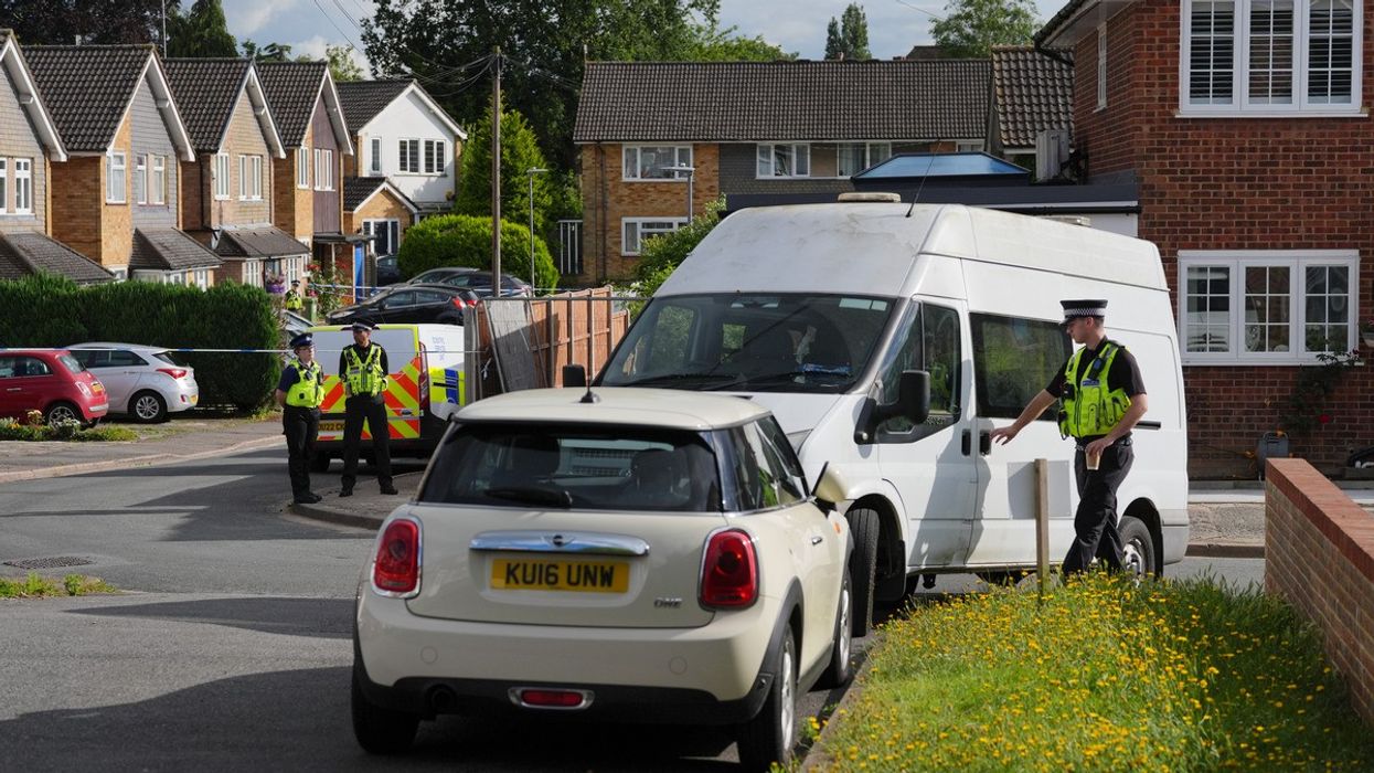 A view of police at the scene in Ashlyn Close, Bushey, Hertfordshire