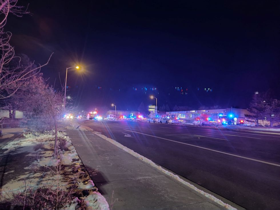 A view of various security and emergency vehicles with flashing blinkers parked on a street, after a shooting in a club, in Colarado Springs, Colorado, U.S November 20, 2022, in this picture obtained from social media. in this picture obtained from social media. Trey Deabueno/TWITTER @TREYRUFFY/via REUTERS  THIS IMAGE HAS BEEN SUPPLIED BY A THIRD PARTY. MANDATORY CREDIT. NO RESALES. NO ARCHIVES.
