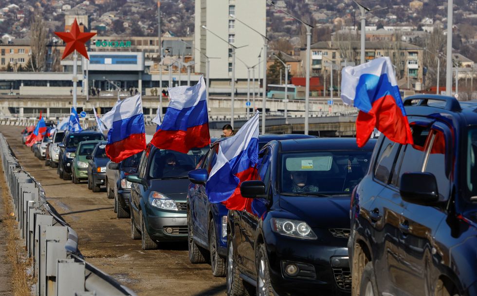 A view shows a motorcade before the start of an automobile rally marking Russia's Defender of the Fatherland Day in the course of Russia-Ukraine conflict in Luhansk, Russian-controlled Ukraine, February 23, 2023. REUTERS/Alexander Ermochenko