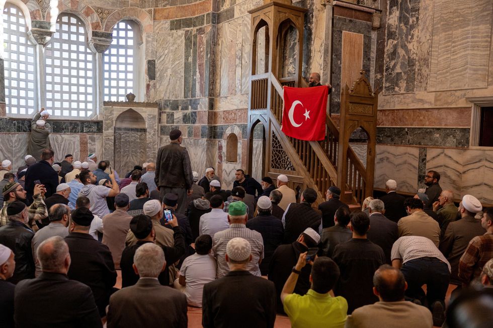 A visitor takes a picture at Chora Museum or Kariye Mosque,