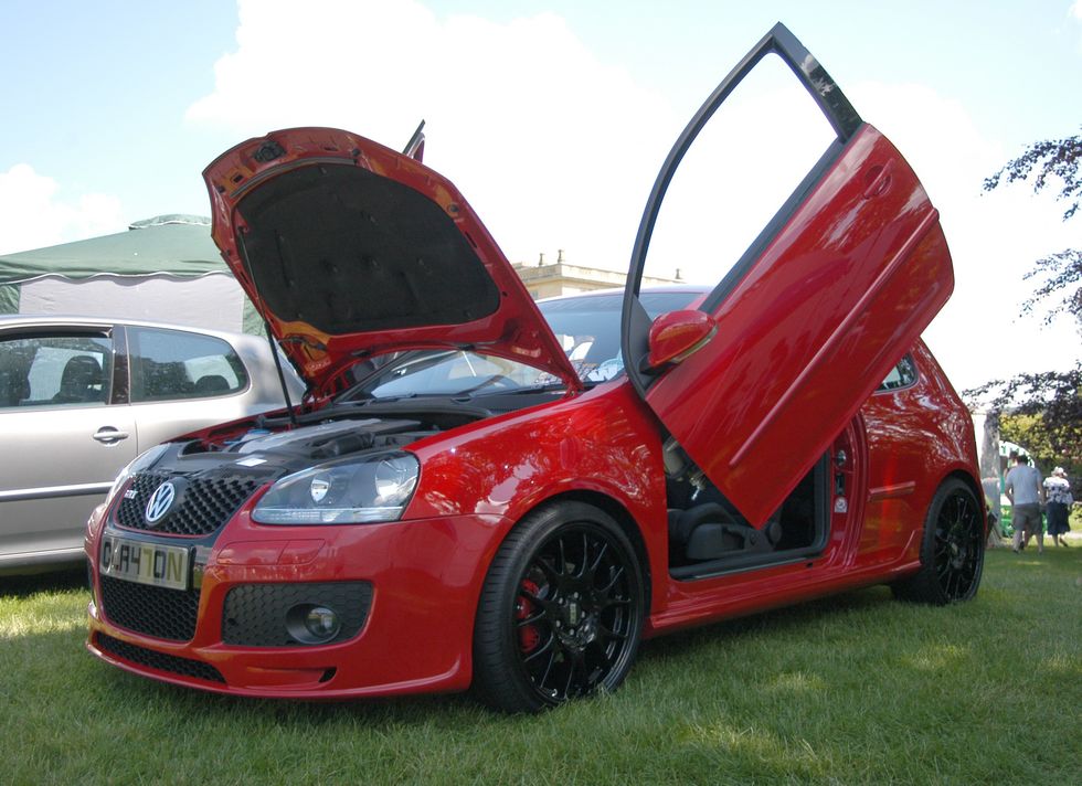 A Volkswagen Golf with vertically opening doors