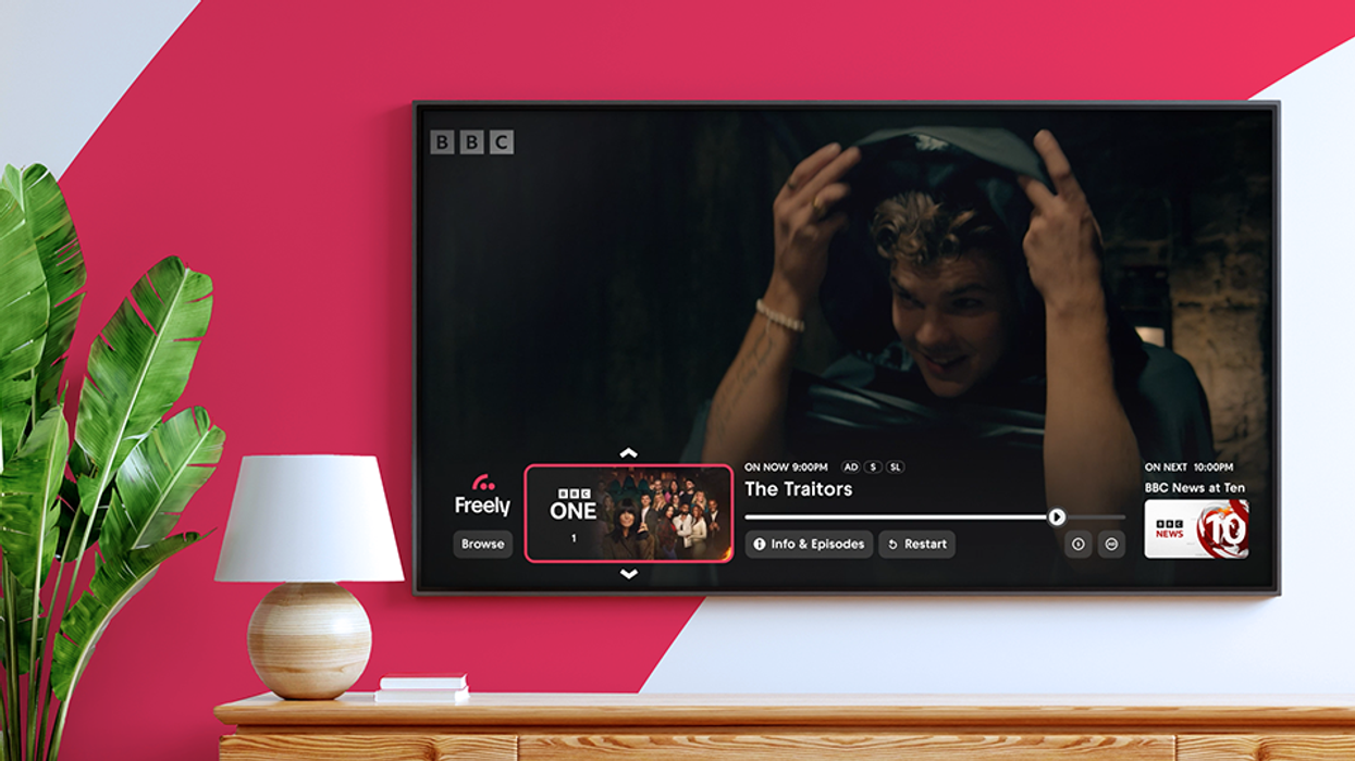 a wall-mounted television with the freely user interface on-screen watching The Traitors on BBC One