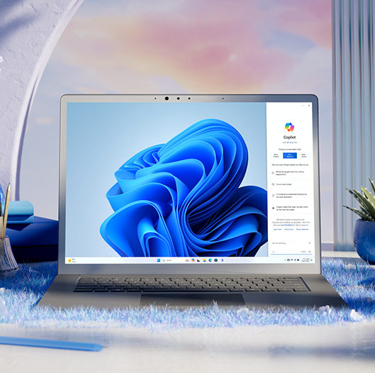 a windows 11 laptop is pictured with an abstract background