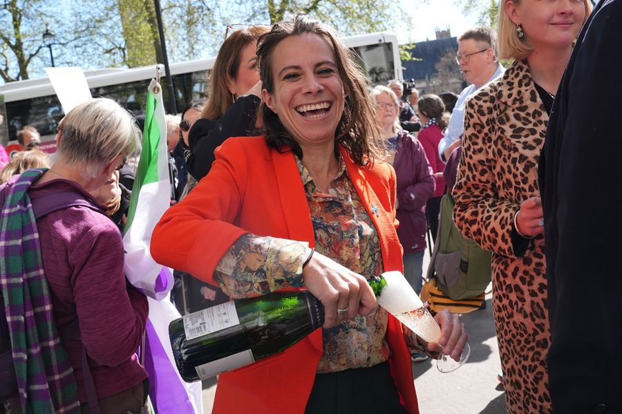 A woman celebrates today's landmark Supreme Court ruling