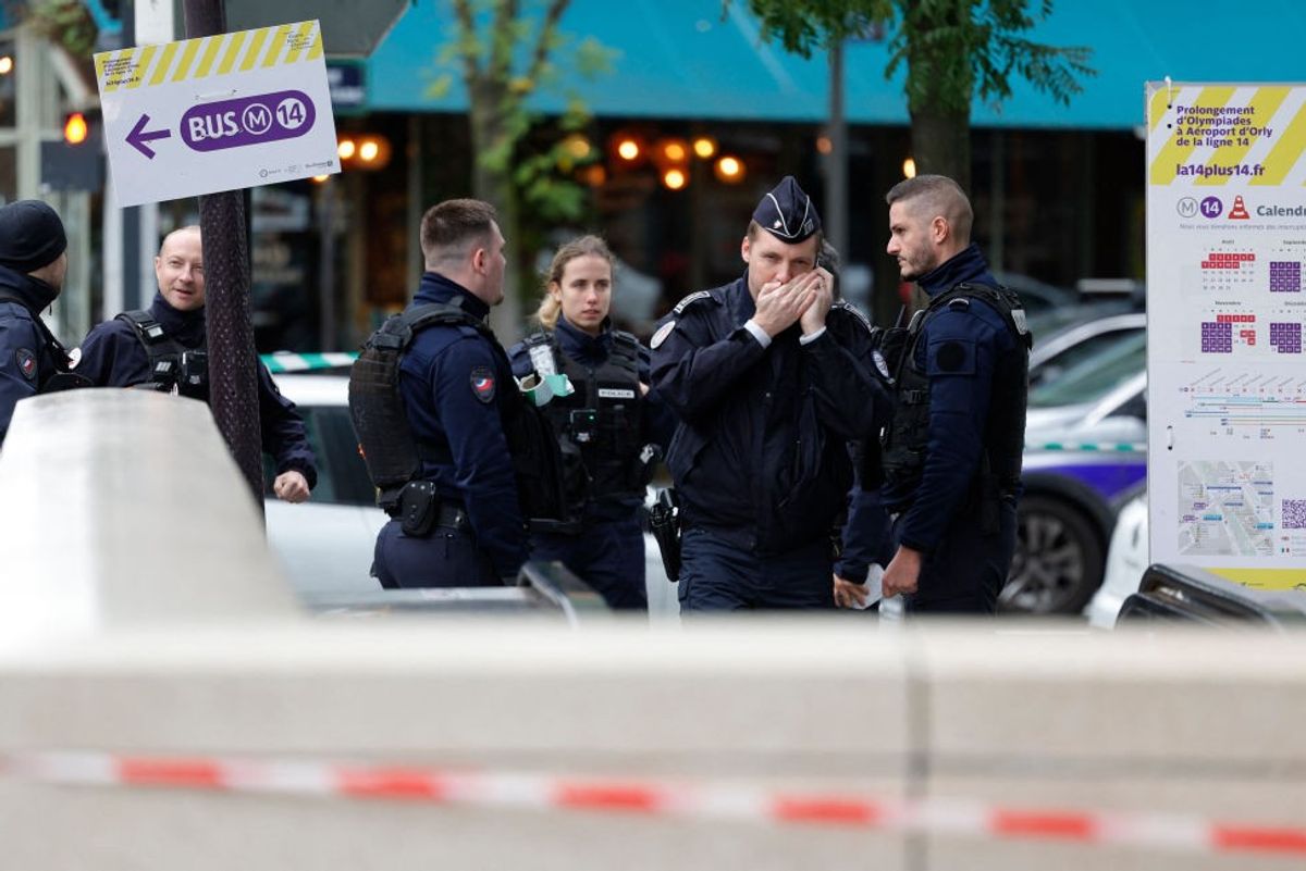 A woman has been shot by police after "threatening to blow herself up while screaming Allahu Akbar" while wearing an Islamic veil in Paris