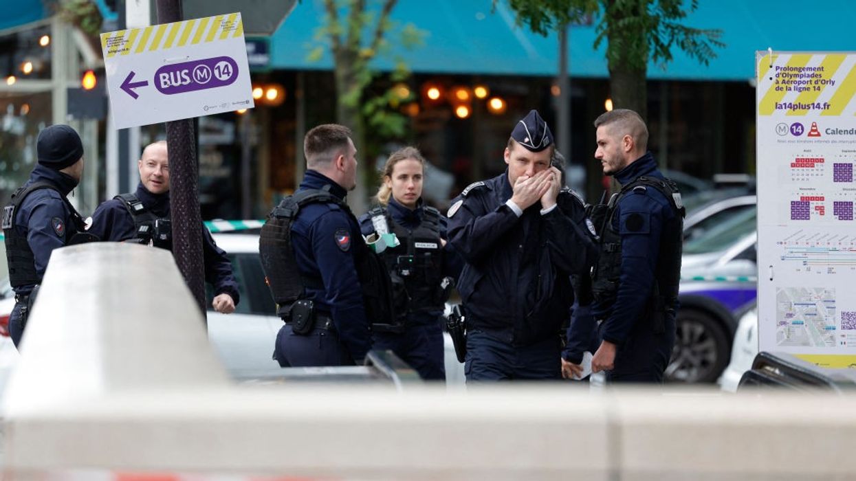 A woman has been shot by police after "threatening to blow herself up while screaming Allahu Akbar" while wearing an Islamic veil in Paris