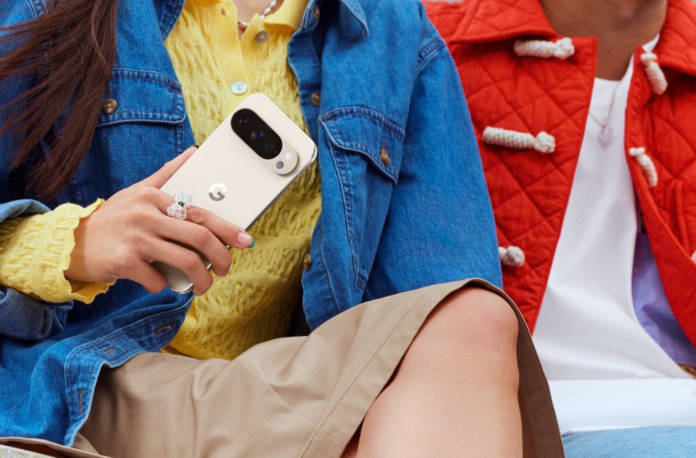a woman in a denim jacket holds the new pixel 10 Pro