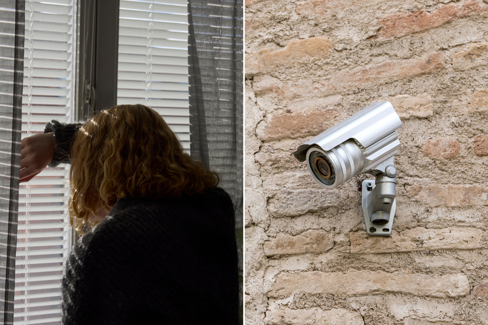 A woman looking through blinds and a CCTV camera