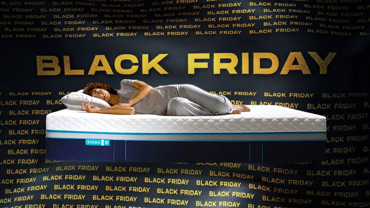 a woman sleeps on a simba mattress with black friday sale banner behind her